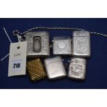 Silver and white metal vesta cases