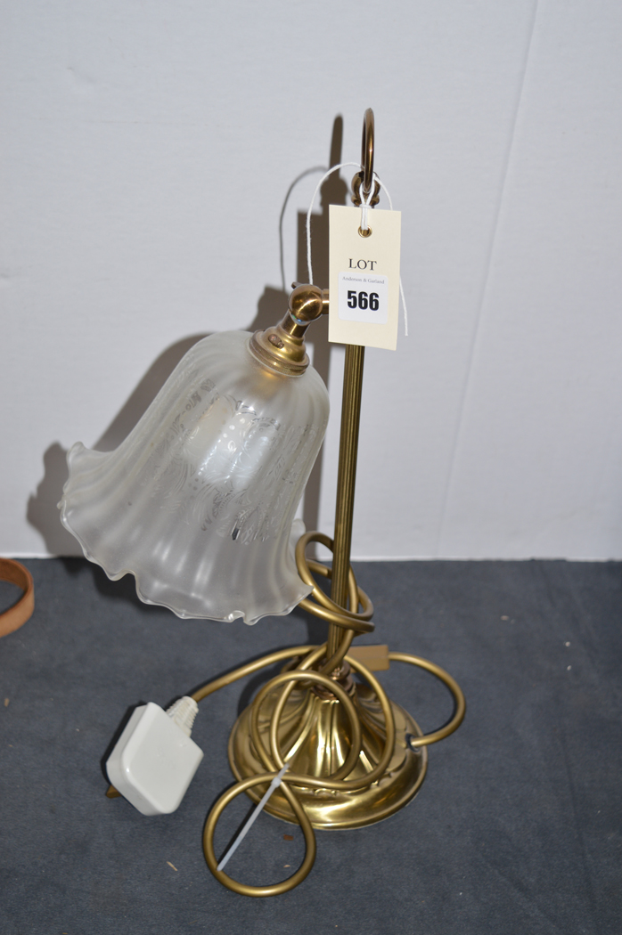 Brass table lamp with glass shade.