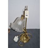 Brass table lamp with glass shade.