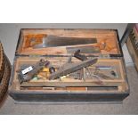 A wooden tool box and contents.