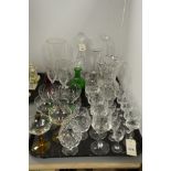 Glassware to include cut glass decanters, jug, vase and glasses of various size