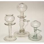 Glass lace maker's lamp, inverted baluster and bobbin stem rising to globe form reservoir,