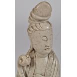 Large Chinese hardstone figure of Guanyin, her head turned slightly to her left,