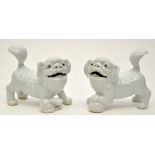 Two Chinese white ware Buddhist lions,