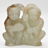 Celadon jade figure of two boys, possibly alluding to a Daoist immortal, one holding a peach branch,