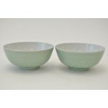 Pair of carved Chinese celadon bowls,