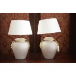 A pair of ceramic table lamps in the form of shouldered vases,