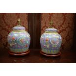 A pair of modern Chinese ceramic table lamps in the form of ginger jars (no shades).