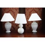 A pair of modern ceramic table lamps in the form of shouldered vases with floral decoration,