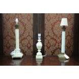 Two corinthian column pattern table lamps, one with a white ceramic column,