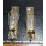 A pair of modern brass wall light fittings, on rectangular plinth bases,