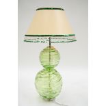 William Yeoward: a large green tinted glass table lamp in the form of two globes with horizontal