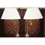 A pair of modern lacquered brass adjustable cantilever table lamps,