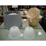 A collection of table lampshades,