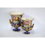 A graduated pair of Regency Derby campana vases with reserves painted with vases of flowers,