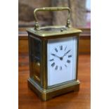 A French brass hour-repeating carriage clock, striking on a coiled gong,