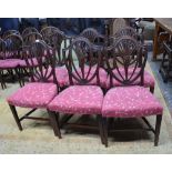 A set of six George III mahogany side chairs with arched crests over pierced fan splats and