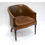 A Victorian style mahogany framed brass studded tan leather upholstered library chair,