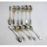 A matched set of eleven William IV/Victorian silver fiddle pattern teaspoons, various makers,