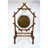 A Victorian ivory mounted bamboo dinner gong stand with cast circular gong,