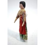 A 19th century painted wood peg doll with articulated limbs, 28 cm,