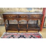 An 18th century oak low dresser,