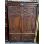 A late 17th/early 18th century oak livery cupboard,