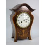 A French fin de siecle inlaid mahogany mantle clock with arched top on ogee case,