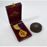 A Victorian gilt metal Primrose League medal in original case from T & J Bragg,