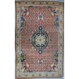 A good Feraghan Saruk / Tabriz rug, the central medallion deign on pale red ground,