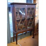 Butler, Dublin, a George III mahogany diamond glazed bookcase on stand,