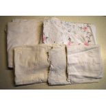 Two boxes of linen to include an embroidered tablecloth, damask tablecloth,