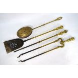 A brass three-piece set of fire-irons,