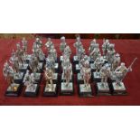A collection of 28 polished pewter figures - British military uniforms,