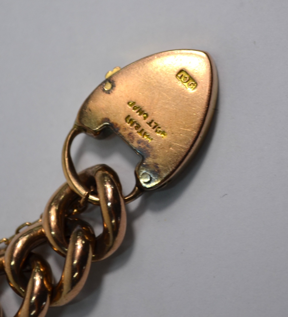 A rose-coloured metal curb bracelet having padlock attached, padlock stamped 9ct, - Image 3 of 3