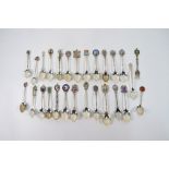 Eight various silver and enamel souvenir spoons,