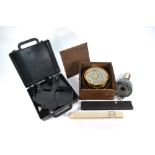 A late 19th century brass gimbal compass with printed paper 12 cm dial,