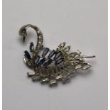A stylised swan brooch set overall with blue and white paste