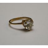 A 9ct yellow gold set heart shaped white stone ring