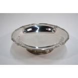 A heavy quality silver fruit bowl with shaped and pierced rim, on shallow foot, Walker & Hall,