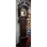 A mahogany longcase clock, the eight day movement with arched brass dial,