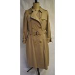 A lady's Burberrys' traditional raincoat with polished horn effect buttons,