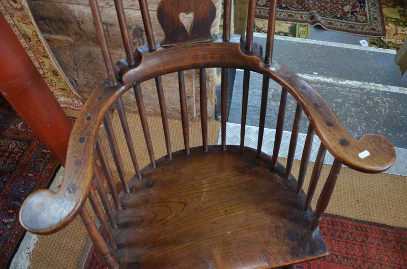 A 19th century elm seat comb back chair with flat arms, - Image 4 of 6