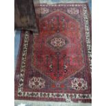 An old Persian Hamadan rug, circa 1920's, the red ground centred by a medallion, 1.48 x .