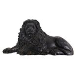 A large cast iron recumbent lion plaque/doorstop,