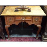 A 19th century oak low boy, having a trio of frieze drawers,