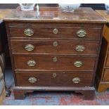 An 18th century mahogany chest of four long graduated drawers beneath a brush slide,