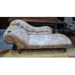 A Victorian scroll end chaise lounge raised on turned walnut legs to castors,