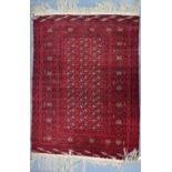 A fine Persian Turkmen design rug, red ground,
