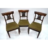 A set of six Regency period simulated rosewood side chairs each having scroll-over bar backs over